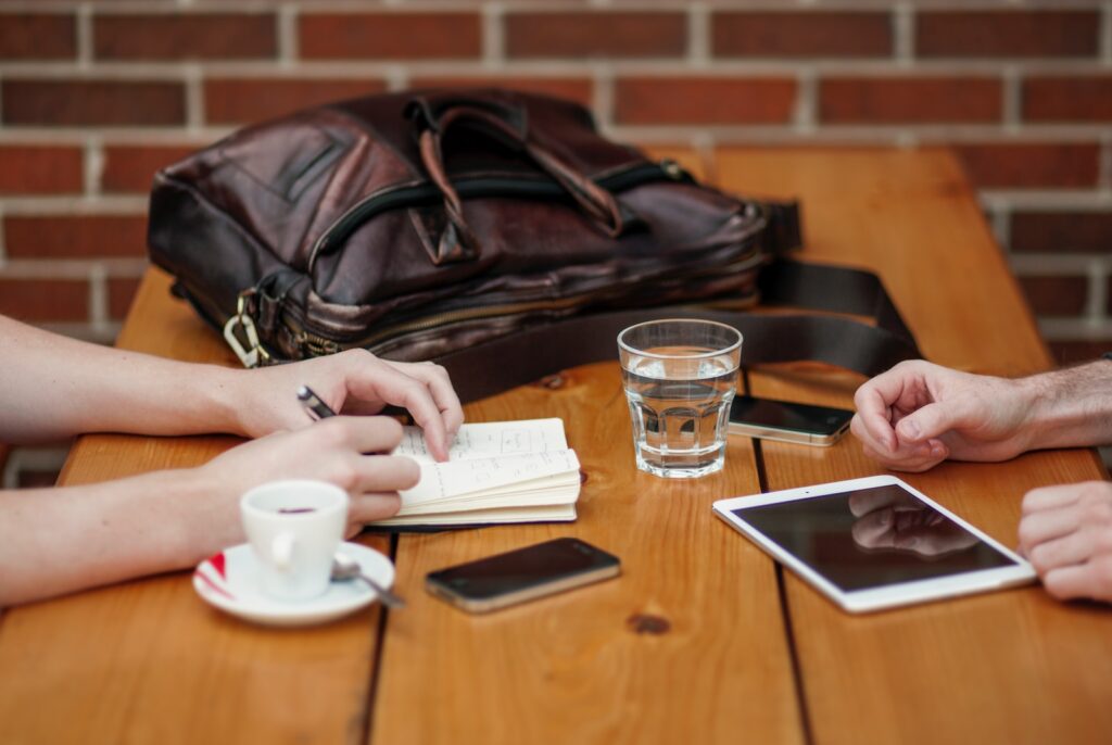 two person sitting in front of table