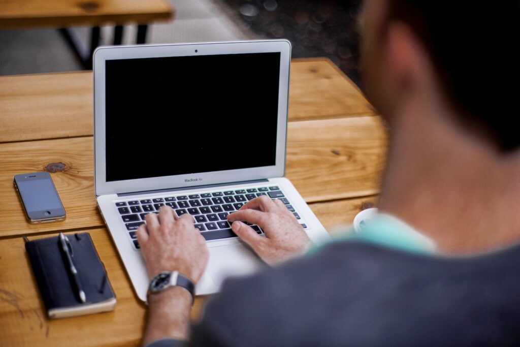 man using MacBook Air